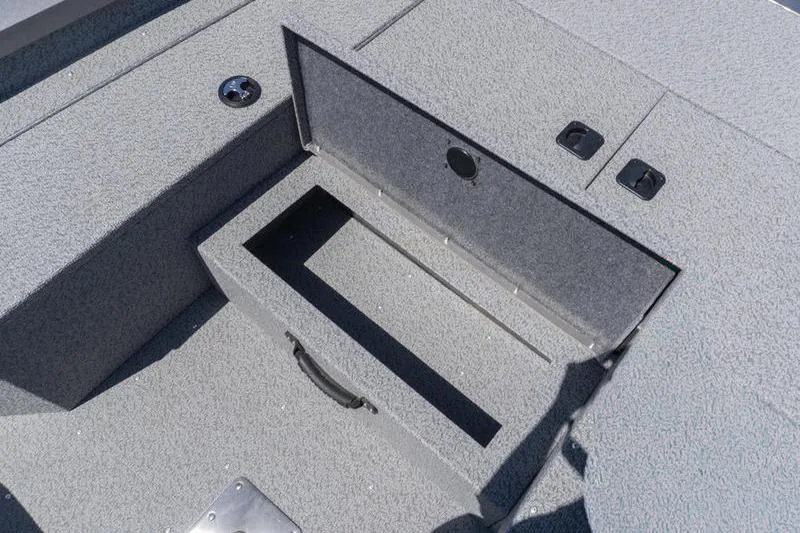 Slide: The Image of 2026 G3 Sportsman 1810 boat storage compartment with textured gray finish. - 10