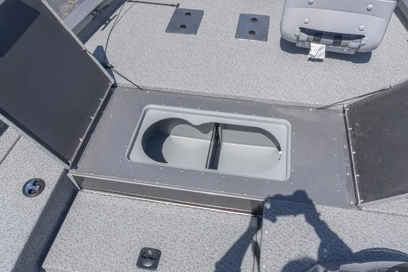 Slide: The Image of 2026 G3 Sportsman 1810 boat interior with open storage compartment and seating. - 12