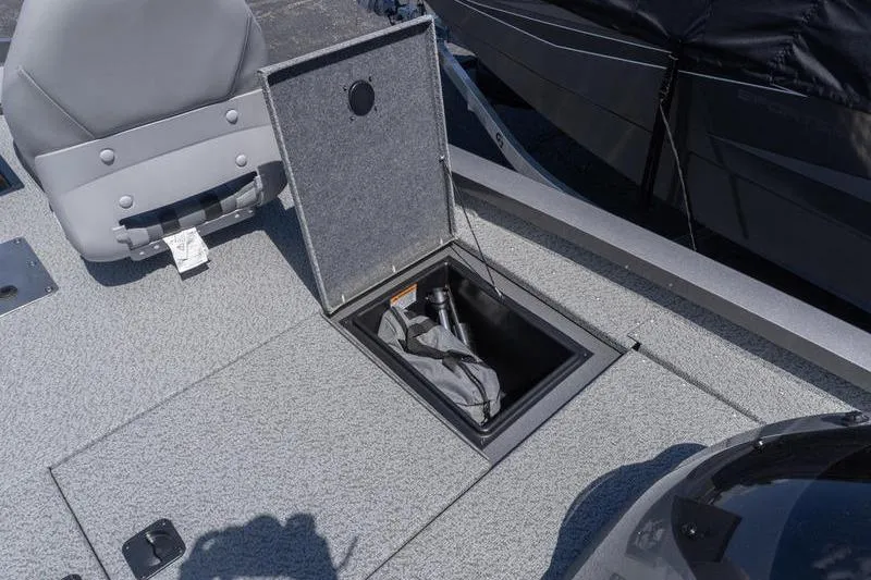 Slide: The Image of 2026 G3 Sportsman 1810 boat with open storage compartment and seating. - 13