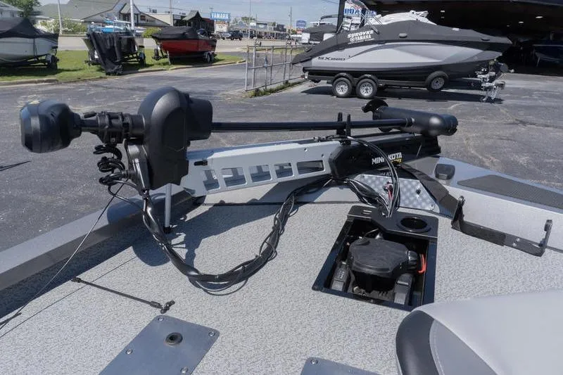 Slide: The Image of 2026 G3 Sportsman 1810 boat with trolling motor in a dealership lot. - 14