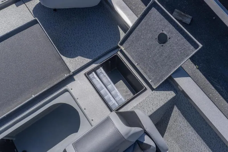 Slide: The Image of Open storage compartment on 2026 G3 Sportsman 1810 boat, showcasing organized interior space. - 19