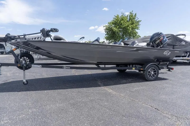 Slide: The Image of 2026 G3 Sportsman 1810 boat on trailer, parked outdoors under clear sky. - 4
