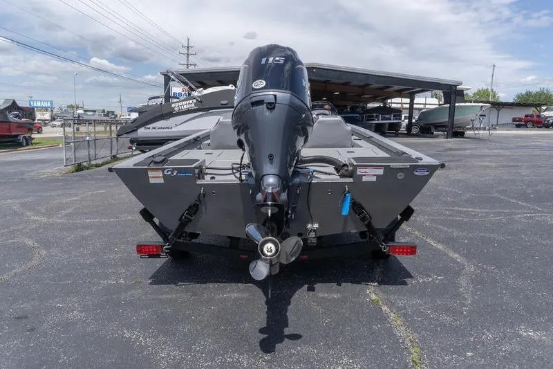 Slide: The Image of 2026 G3 Sportsman 1810 boat with powerful outboard motor, parked in a dealership lot. - 5