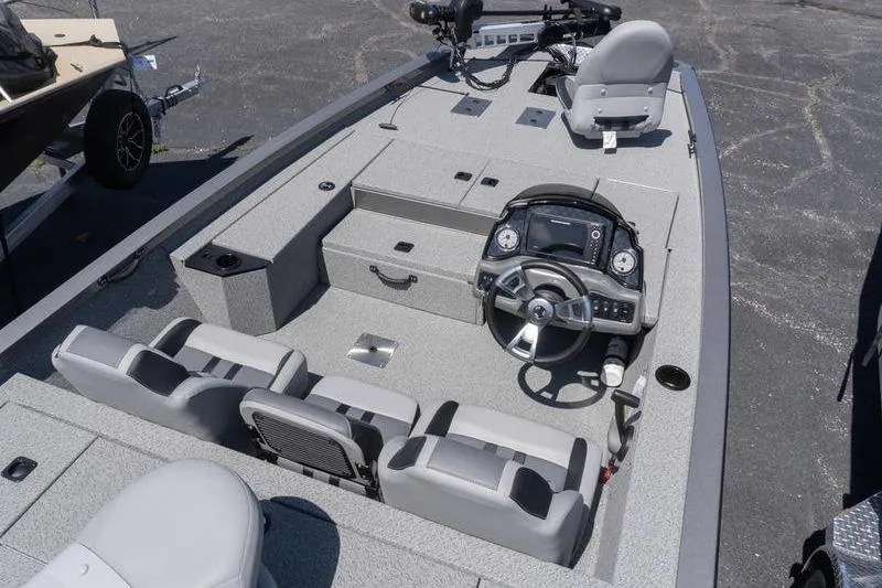 Slide: The Image of 2026 G3 Sportsman 1810 boat interior with steering console and seating. - 6