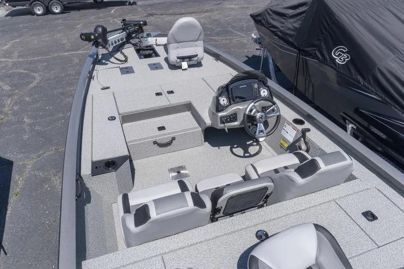Slide: The Image of 2026 G3 Sportsman 1810 boat interior with steering console and seating. - 7