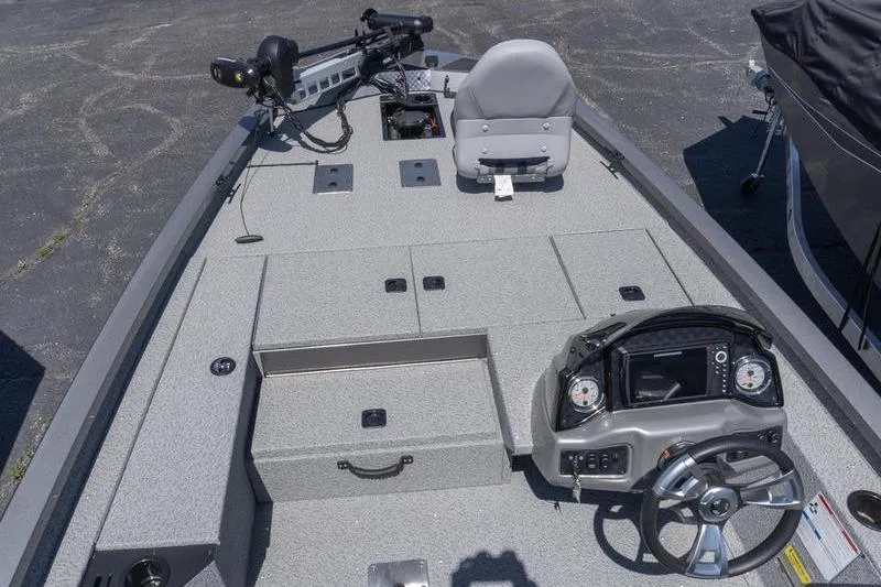 Slide: The Image of 2026 G3 Sportsman 1810 boat interior with steering console and seating. - 9