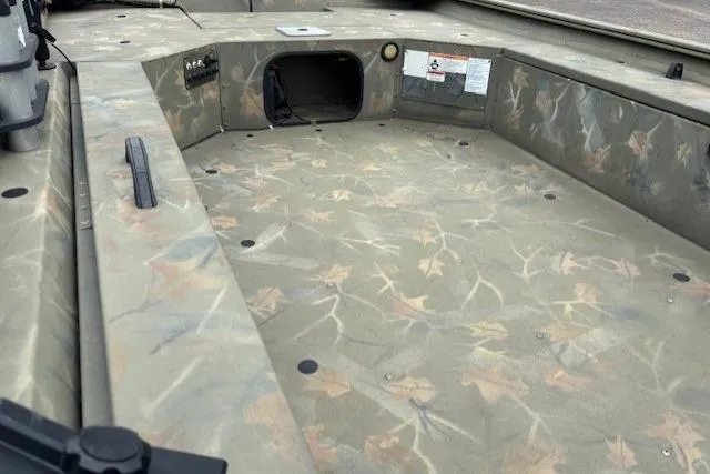 Slide: The Image of 2017 Tracker Grizzly 1654 MVX Sportsman boat interior with camouflage pattern. - 16