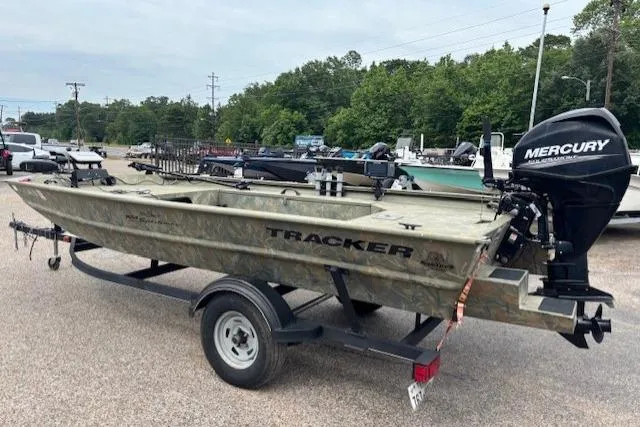 Slide: The Image of 2017 Tracker Grizzly 1654 MVX Sportsman boat on trailer with Mercury outboard motor. - 4