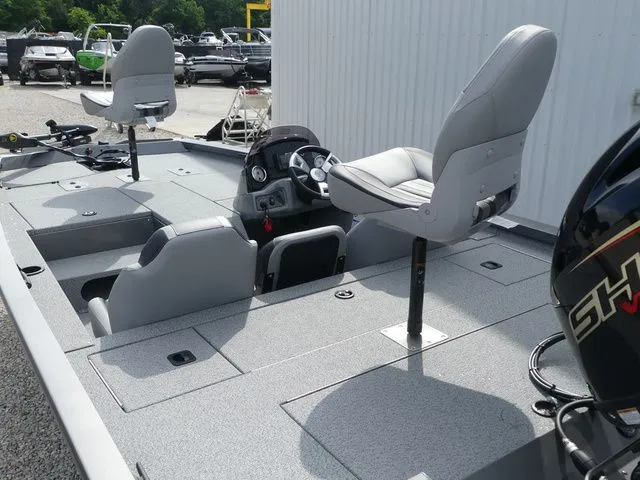 Slide: The Image of 2026 G3 Sportsman 1710 boat with gray seats and steering console. - 18