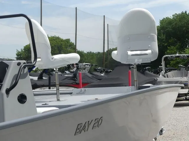 Slide: The Image of 2026 G3 Bay 20 boat with white seats outdoors. - 13
