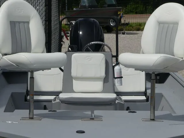Slide: The Image of 2026 G3 Bay 20 boat with white seats and steering console. - 16