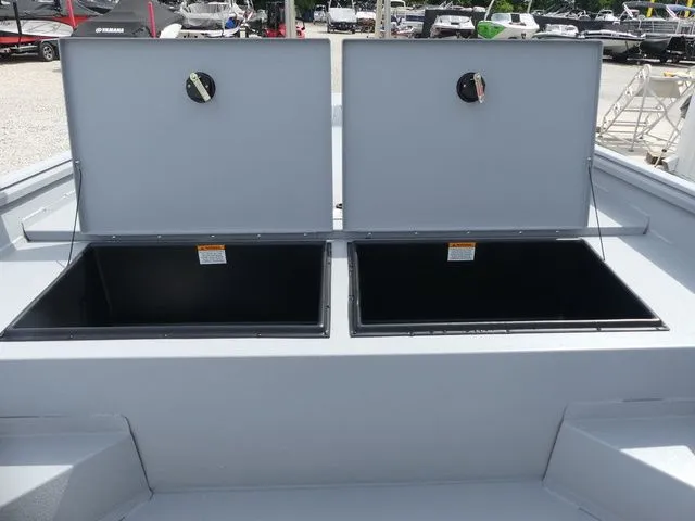 Slide: The Image of 2026 G3 Bay 20 boat with open storage compartments. - 21