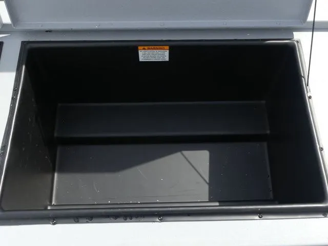 Slide: The Image of Open storage compartment in G3 Bay 20 boat, year 2026. - 22