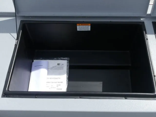 Slide: The Image of Open storage compartment in G3 Bay 20 boat, year 2026. - 23
