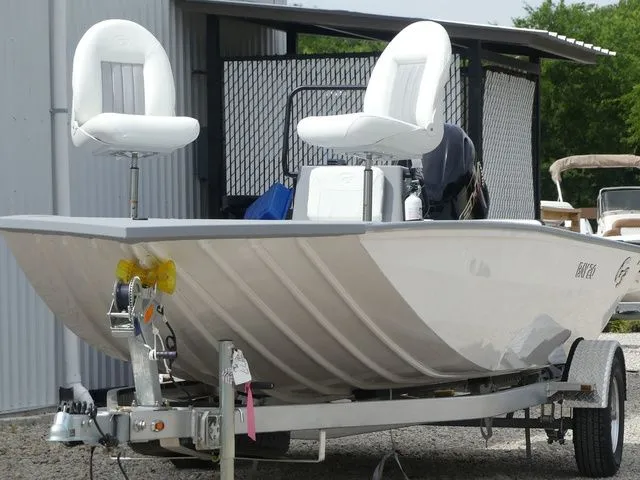 Slide: The Image of 2026 G3 Bay 20 boat on trailer, white seats, outdoor storage. - 4