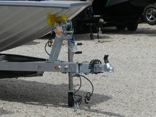 Slide: The Image of G3 Bay 20 boat trailer, 2026 model, parked on gravel surface. - 6