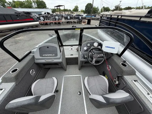 Slide: The Image of Interior view of a 2016 Starweld 18 Pro boat with Yamaha engine. - 6