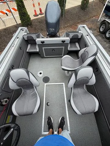 Slide: The Image of Interior of a 2016 Starweld 18 Pro boat with 115 HP Yamaha engine. - 8