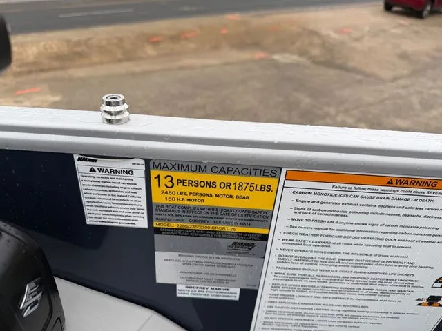 Slide: The Image of Safety warning on Godfrey Sweetwater 2286 SFL Tritoon, capacity: 13 persons or 1875 lbs. - 12