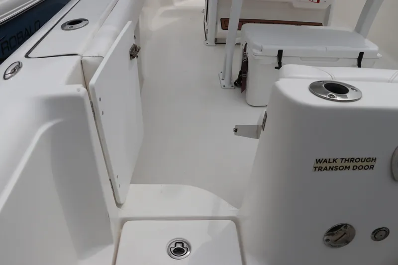Slide: The Image of 2017 Tidewater 252 CC Adventure boat interior with walk-through transom door. - 10