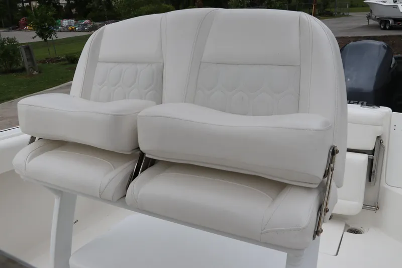 Slide: The Image of White cushioned seats on a 2017 Tidewater 252 CC Adventure boat. - 20