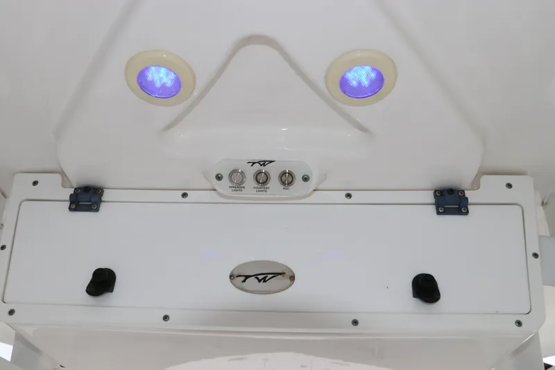 Slide: The Image of Control panel of 2017 Tidewater 252 CC Adventure boat with blue LED lights. - 22