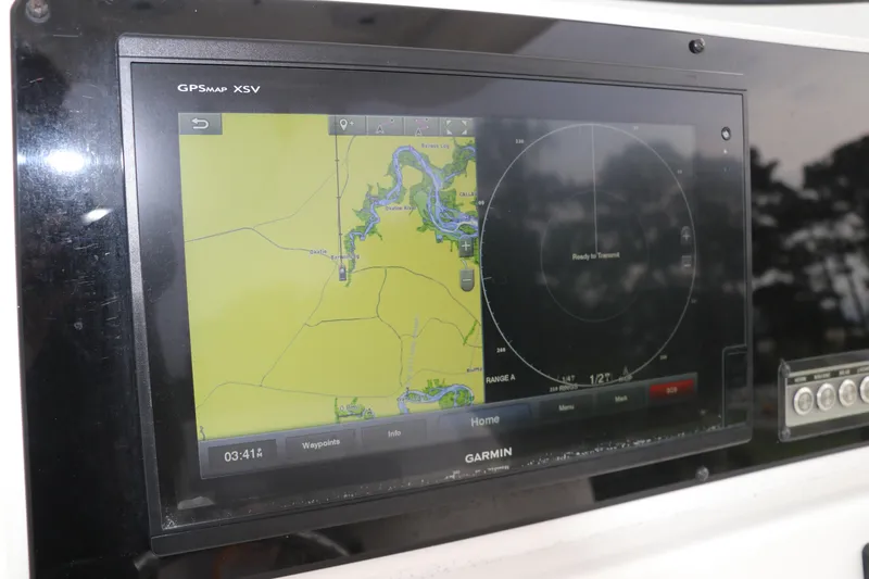 Slide: The Image of Garmin GPS display on 2017 Tidewater 252 CC Adventure boat, showing navigation map. - 24