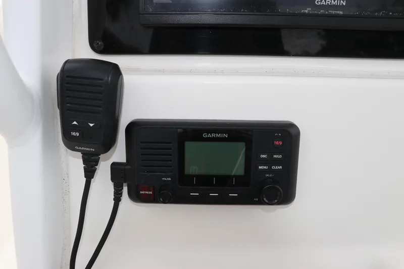 Slide: The Image of Garmin marine radio on 2017 Tidewater 252 CC Adventure boat dashboard. - 25