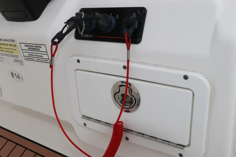 Slide: The Image of Control panel of a 2017 Tidewater 252 CC Adventure boat with safety features. - 30
