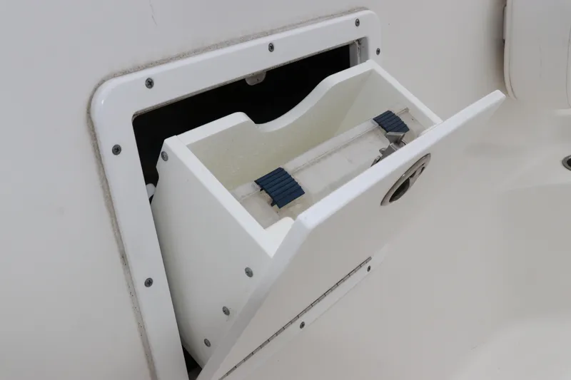 Slide: The Image of 2017 Tidewater 252 CC Adventure boat storage compartment with open hatch. - 33