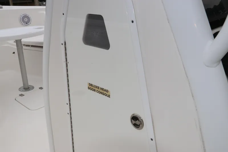 Slide: The Image of 2017 Tidewater 252 CC Adventure boat, featuring deluxe head door console. - 34
