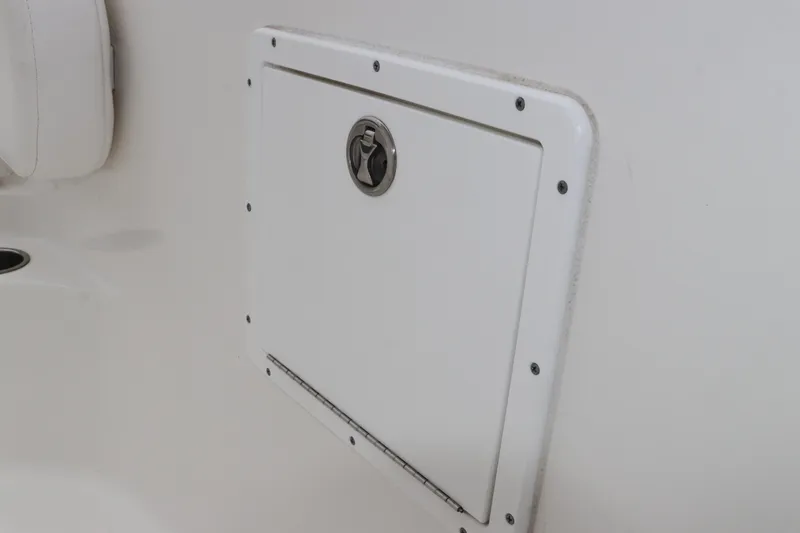 Slide: The Image of Access hatch on 2017 Tidewater 252 CC Adventure boat, featuring secure latch and sleek design. - 36