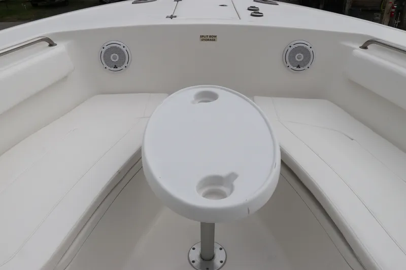 Slide: The Image of 2017 Tidewater 252 CC Adventure boat interior with seating and table. - 42