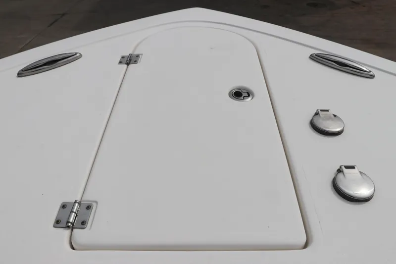 Slide: The Image of Bow deck of 2017 Tidewater 252 CC Adventure boat with storage hatch and cleats. - 44