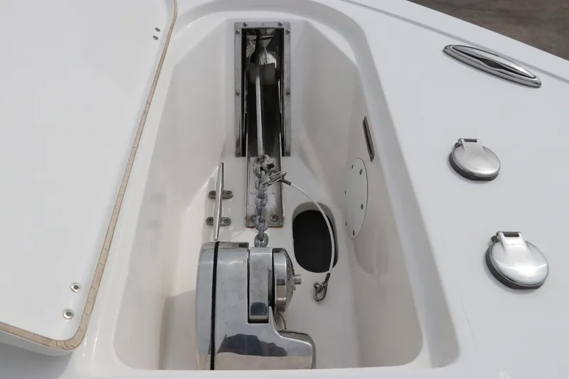 Slide: The Image of Anchor compartment of 2017 Tidewater 252 CC Adventure boat, featuring stainless steel fittings. - 45
