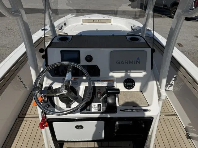 Slide: The Image of Interior view of 2021 Yamaha Boats 195S cockpit with Garmin system. - 12