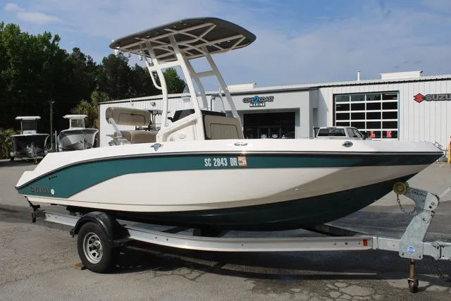 Slide: The Image of 2021 Yamaha Boats 195S on trailer in front of a building. - 5