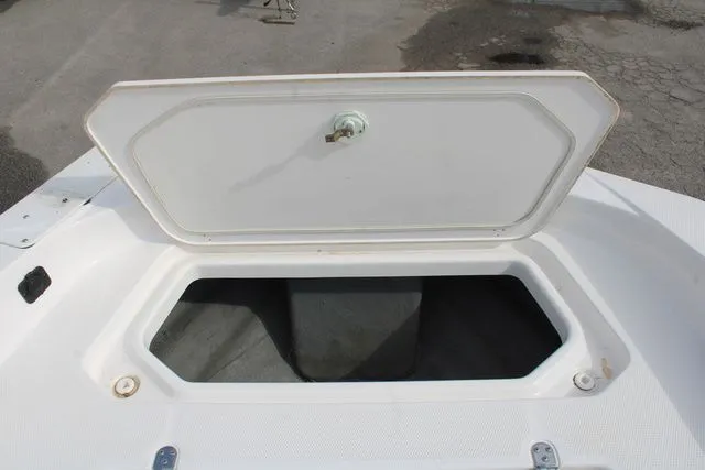 Slide: The Image of Open storage compartment on a 2021 Yamaha Boats 195S. - 7