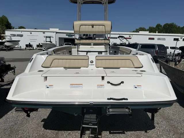 Slide: The Image of Rear view of a 2021 Yamaha Boats 195S with beige interior. - 9