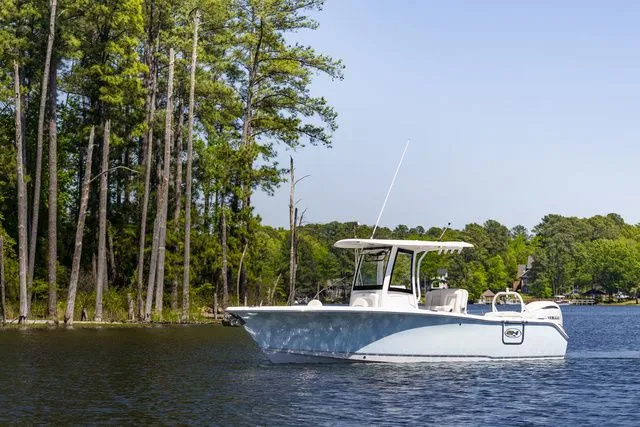 The Image of 2026 Sea Hunt Ultra 255 SE boat on a tranquil lake. - 1
