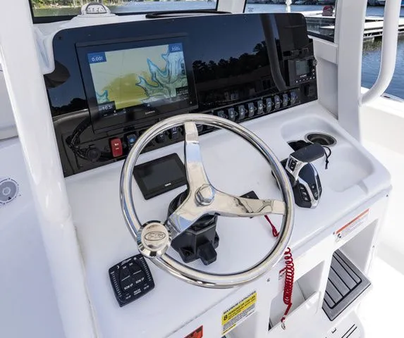 Slide: The Image of 2026 Sea Hunt Ultra 255 SE helm with navigation system. - 10