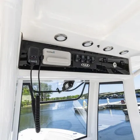 Slide: The Image of Interior view of 2026 Sea Hunt Ultra 255 SE with control console. - 11