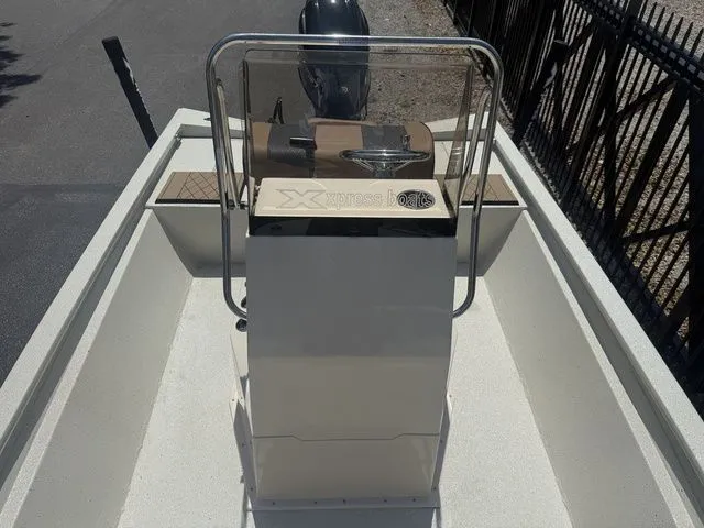 Slide: The Image of Interior view of a 2026 Xpress Boats H190B with steering console. - 13