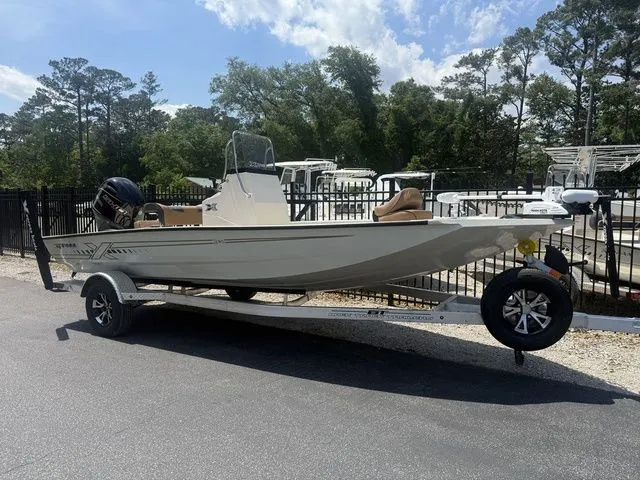 Slide: The Image of 2026 Xpress Boats H190B on trailer, parked outdoors. - 3