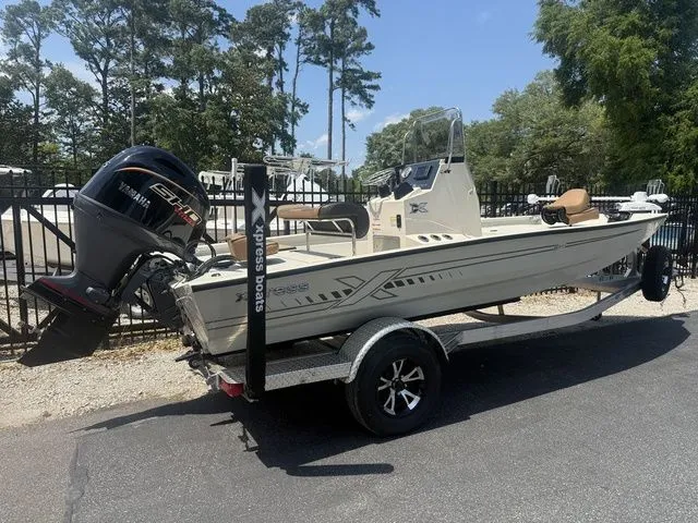 Slide: The Image of 2026 Xpress Boats H190B on trailer, side view. - 4