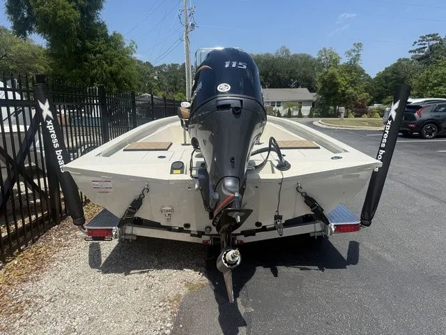 Slide: The Image of Rear view of a 2026 Xpress Boats H190B with outboard motor. - 5