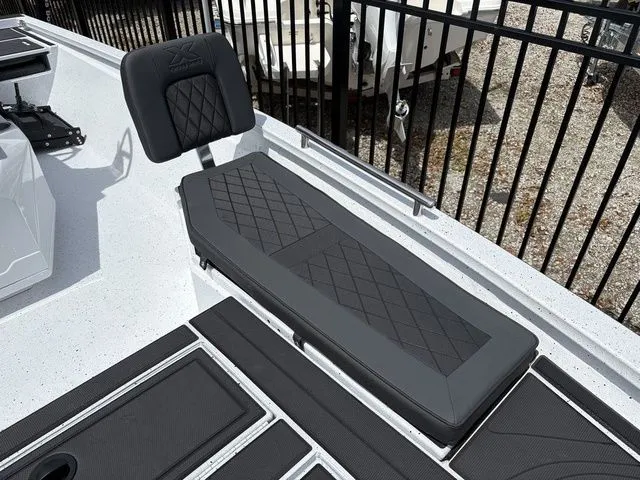 Slide: The Image of 2026 Xpress Boats XR21B seating area with black upholstery. - 12