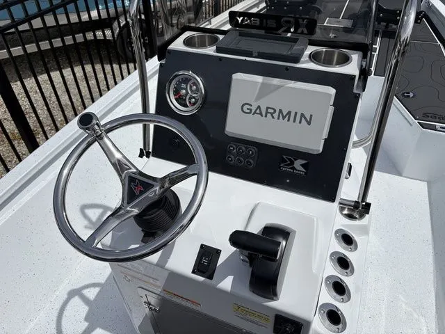 Slide: The Image of Xpress Boats XR21B 2026 console with Garmin navigation system. - 21