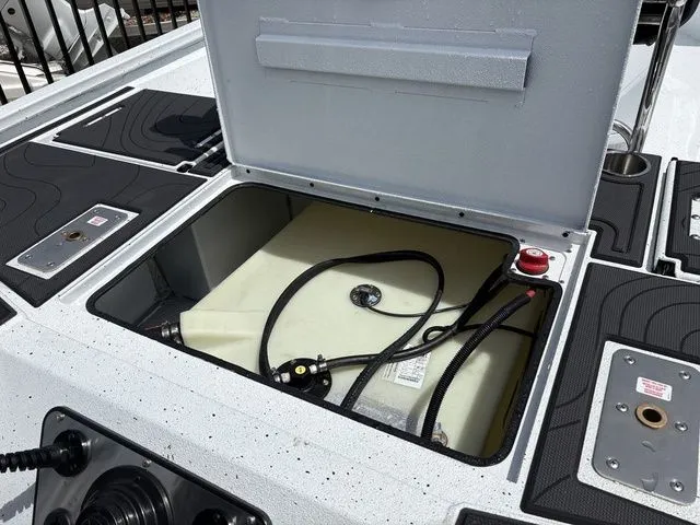 Slide: The Image of 2026 Xpress Boats XR21B with open storage compartment and fuel tank. - 28