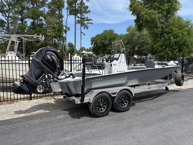 Slide: The Image of 2026 Xpress Boats XR21B on trailer, side view. - 3